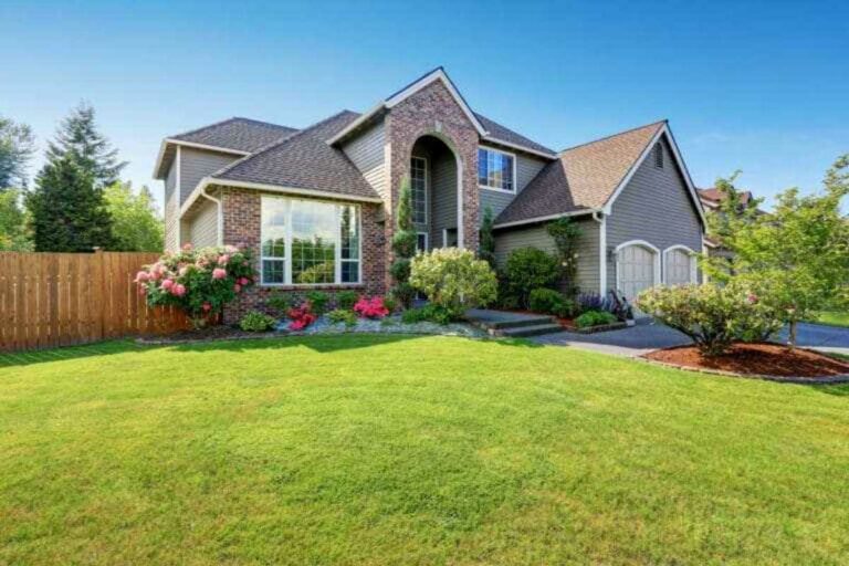 a beautiful house with green lawn Harvey Insurance the best Kennewick Insurance Agency