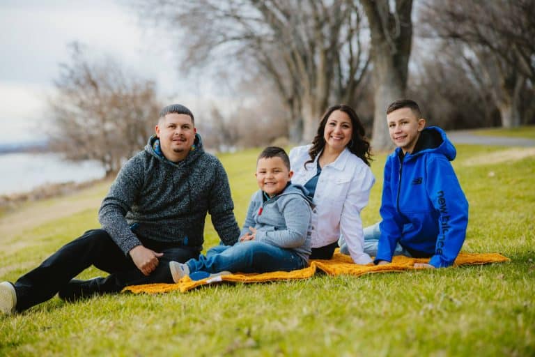 a photo of a family of 4 for their personal insurance coverage